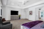 Master Bedroom Features King Bed, 75 Inch TV, En Suite Bath, Walk-In Closet & Pool Views